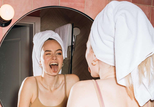 sumer skincare routine girl looking in the mirror